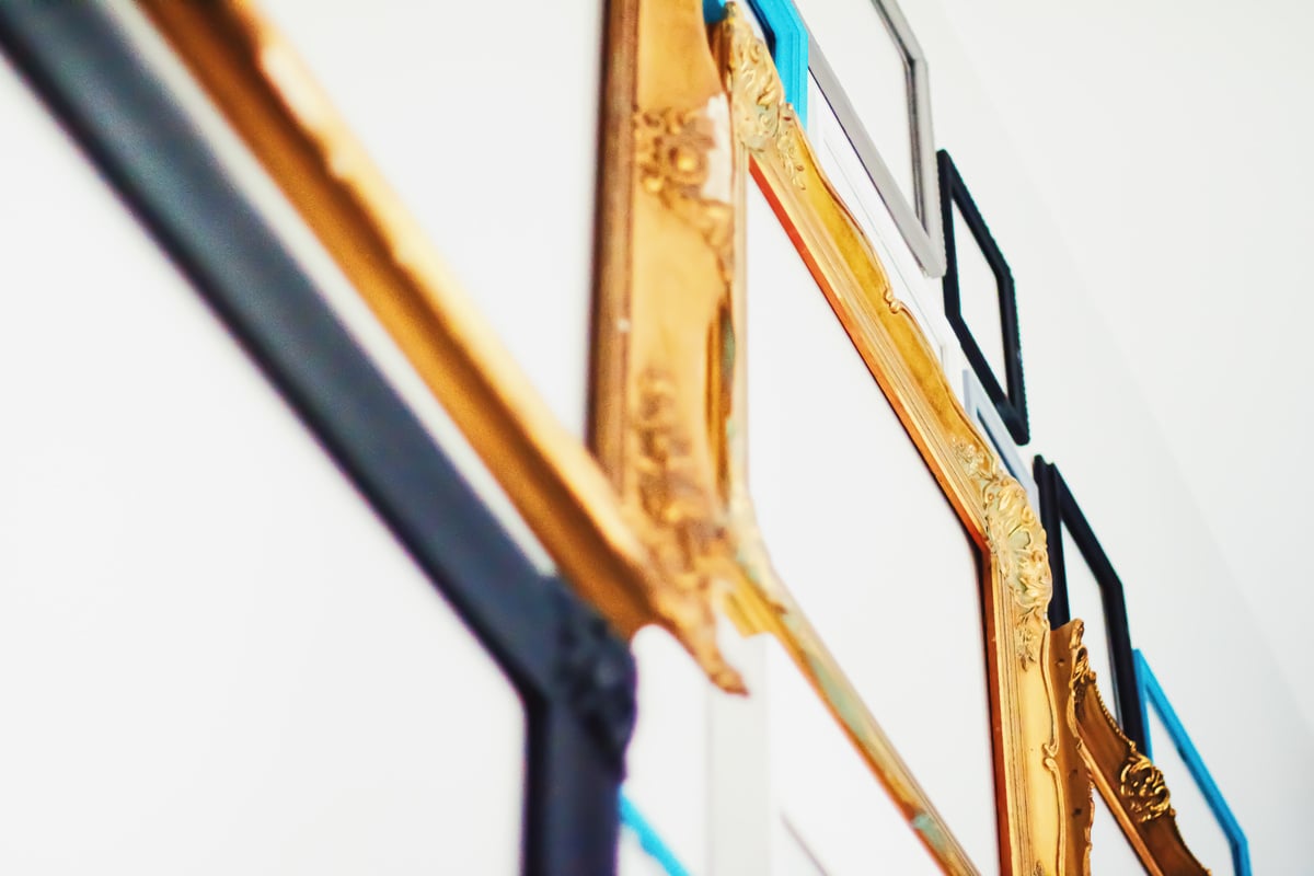 Empty art frames on gallery wall, decor and design